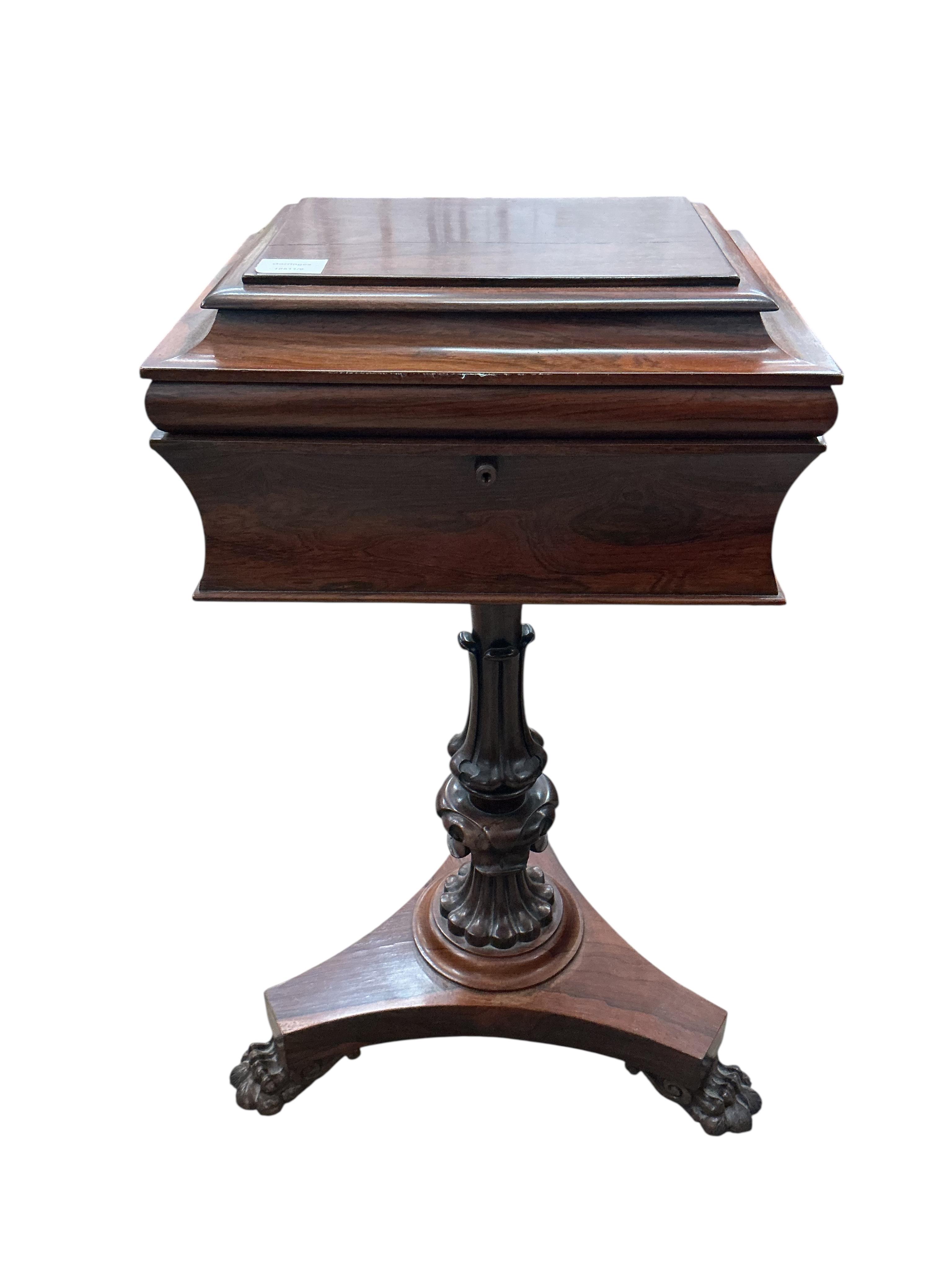 An early Victorian rosewood teapoy, on triangular platform and lion's paw feet, width 40cm, depth 33cm, height 78cm